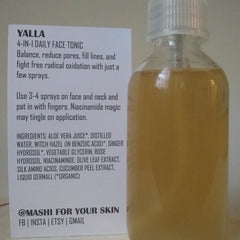 Face tonic bottle with clear plastic, yellow liquid, and white label with text