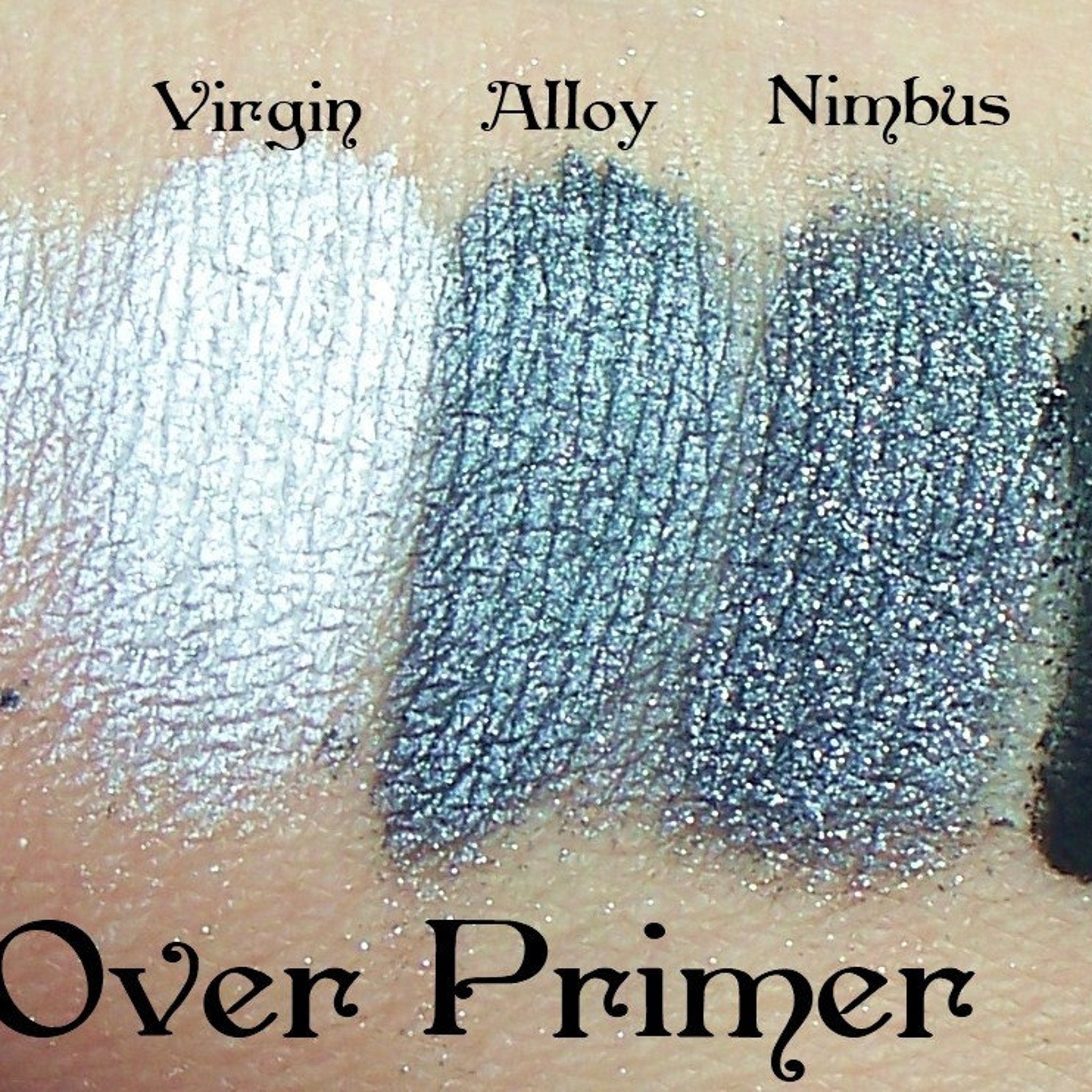 Side view of metallic silver eyeshadow pan catching light with reflective shimmer particles