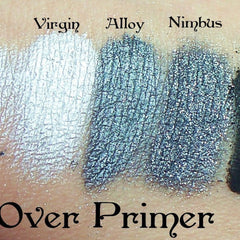 Side view of metallic silver eyeshadow pan catching light with reflective shimmer particles