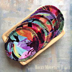 Reusable makeup remover pads with colorful patterned fabric and black stitching, Rocky Mountain Herbs brand