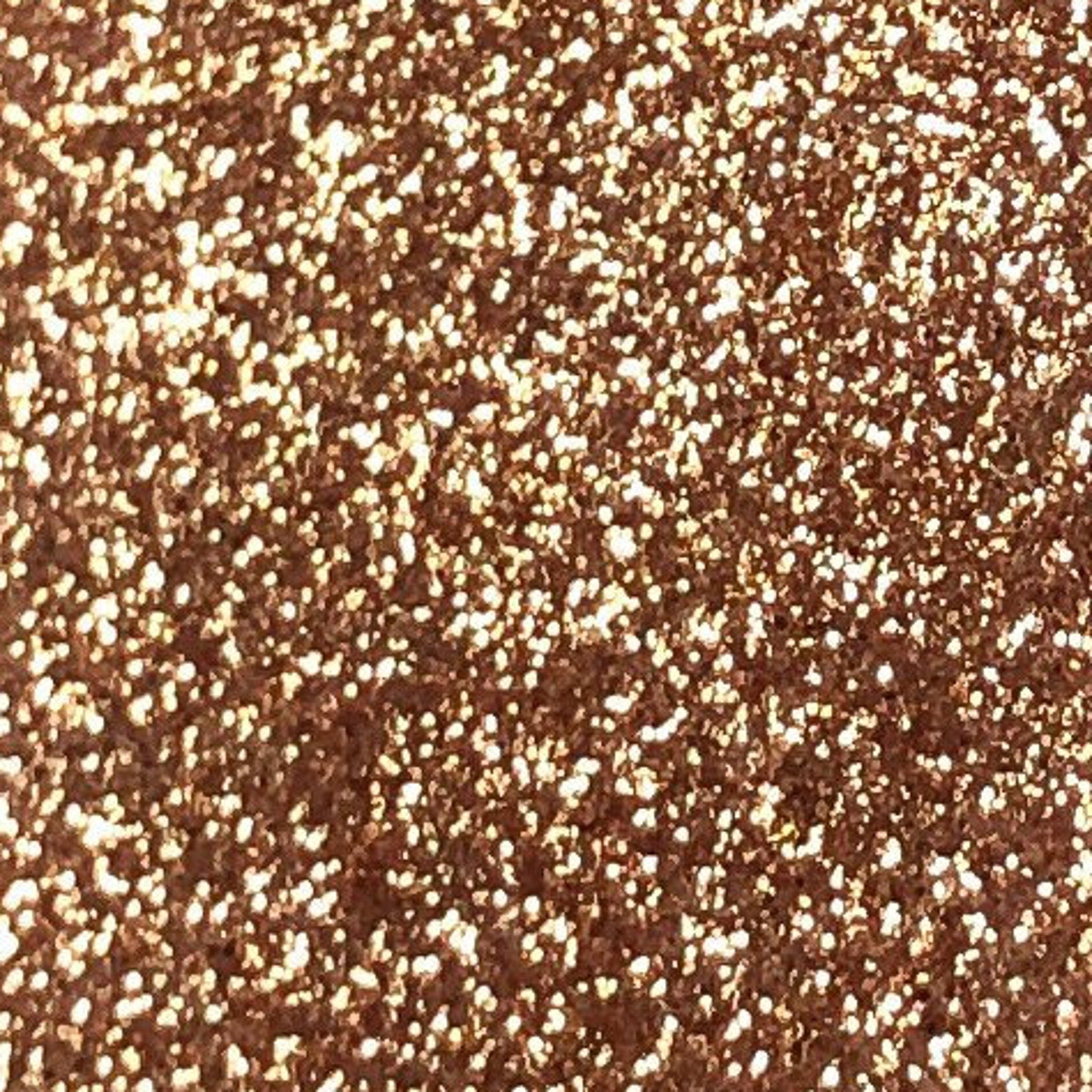 Close-up of Tala Cafe au Lait glitter eye shadow pigment in a small 2ml tube with warm taupe shimmer
