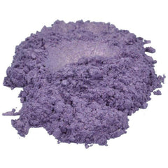 Amethyst purple mica powder eyeshadow scattered artistically on marble surface