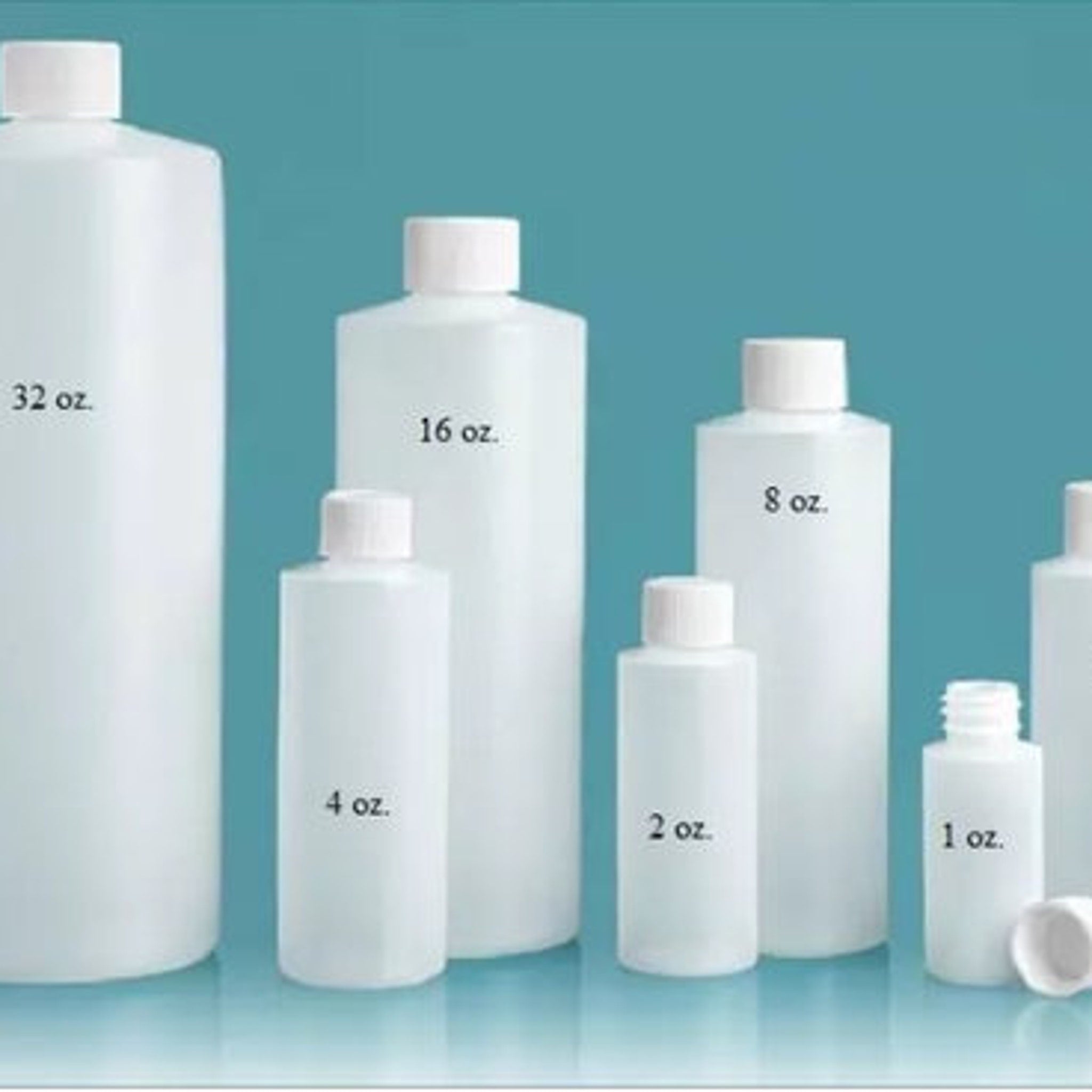 Plastic bottles in various sizes, white with white caps, labeled with ounces