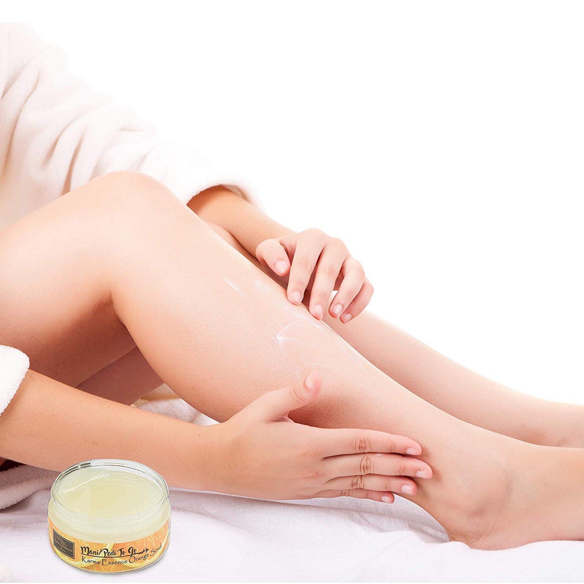 Body lotion application with visible skin, white cream, and Mani Pedi To Go jar label visible
