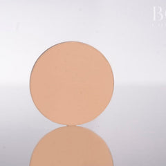 Single pressed eyeshadow pan in soft matte pink shade with smooth texture, 37mm diameter
