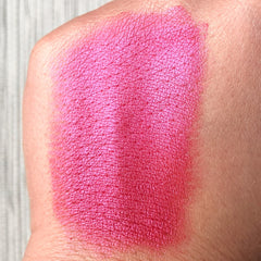 Close-up of Tala Rose Wine R1 Eye Shadow Pigment showing shimmering burgundy powder texture in compact
