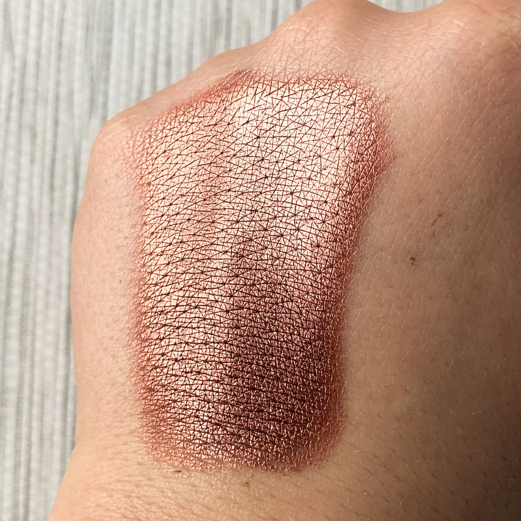 Close-up of Tala Gingerbread BR7 Eye Shadow Pigment showing rich bronze shimmer in compact 2ml jar