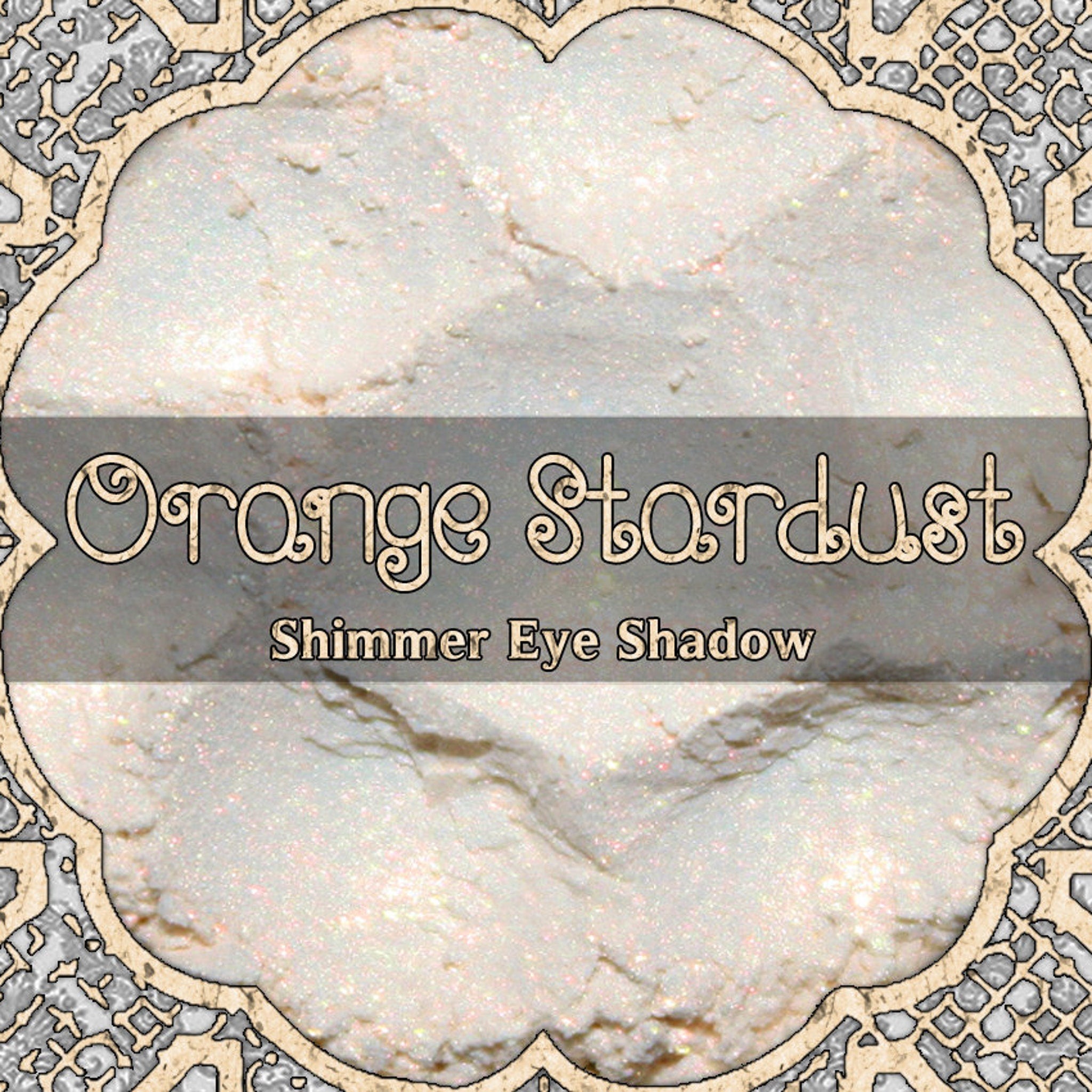 Orange Stardust loose eyeshadow with iridescent shimmer in a clear jar, vegan cosmetic powder