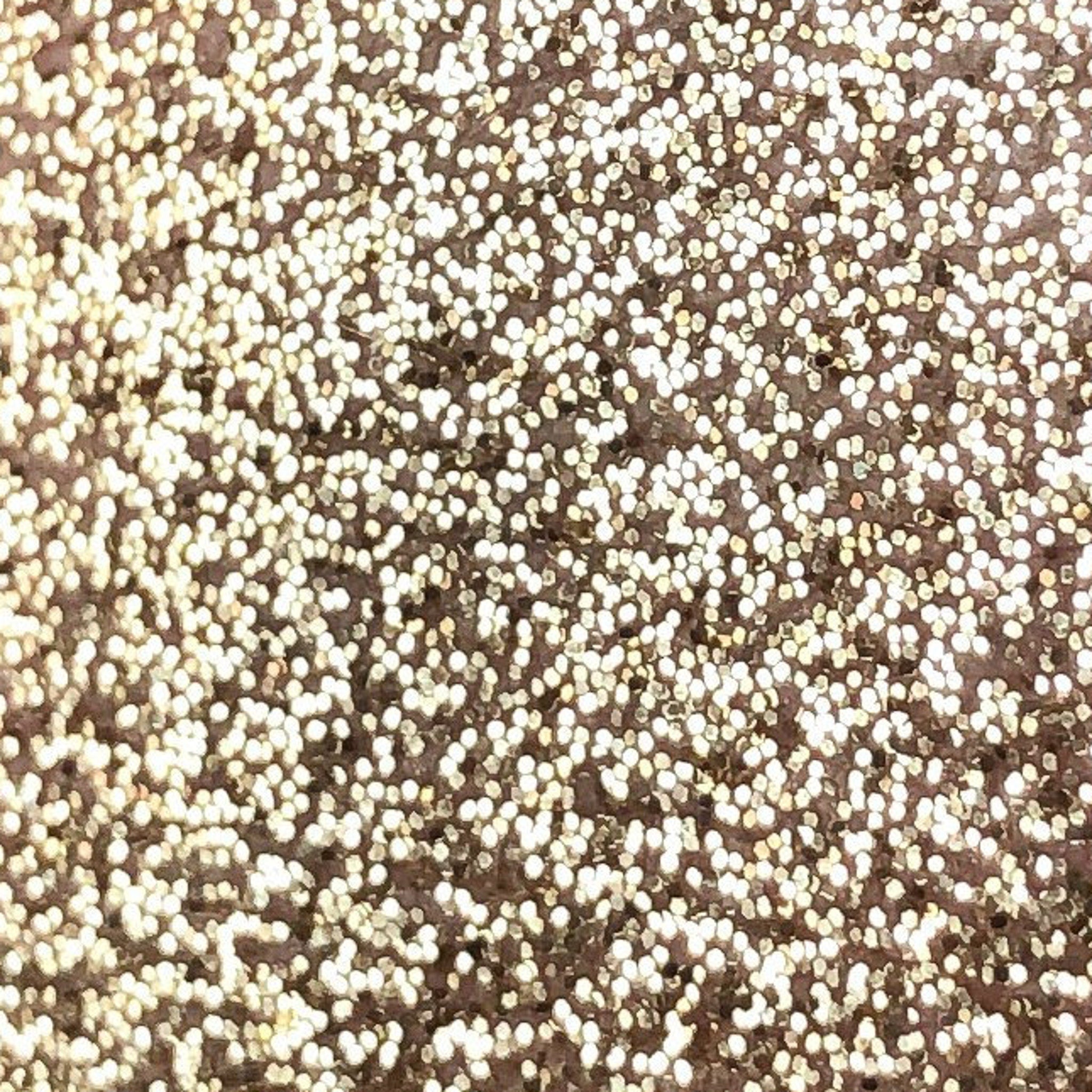 Golden glitter eye shadow pigment in a small 2ml tube with shiny metallic packaging