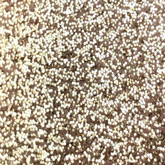 Golden glitter eye shadow pigment in a small 2ml tube with shiny metallic packaging