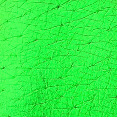 Eye shadow pigment, neon green, textured surface, cracked pattern