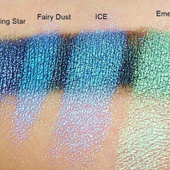 Close-up of iridescent scarab green eyeshadow being applied with a fluffy brush for a shimmery look