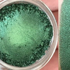 Close-up of CAMO Green vegan mineral eyeshadow in compact with matte finish and earthy tone