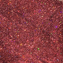 Side view of holographic pink glitter eyeshadow pot showing ultrafine sparkle texture and reflective finish