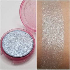 Silver blue vegan pressed eyeshadow in compact with reflective finish and smooth texture