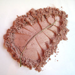 Close-up of Pure & Natural Sahara Mineral Eye Shadow in a compact with earthy-toned powder and sleek black case
