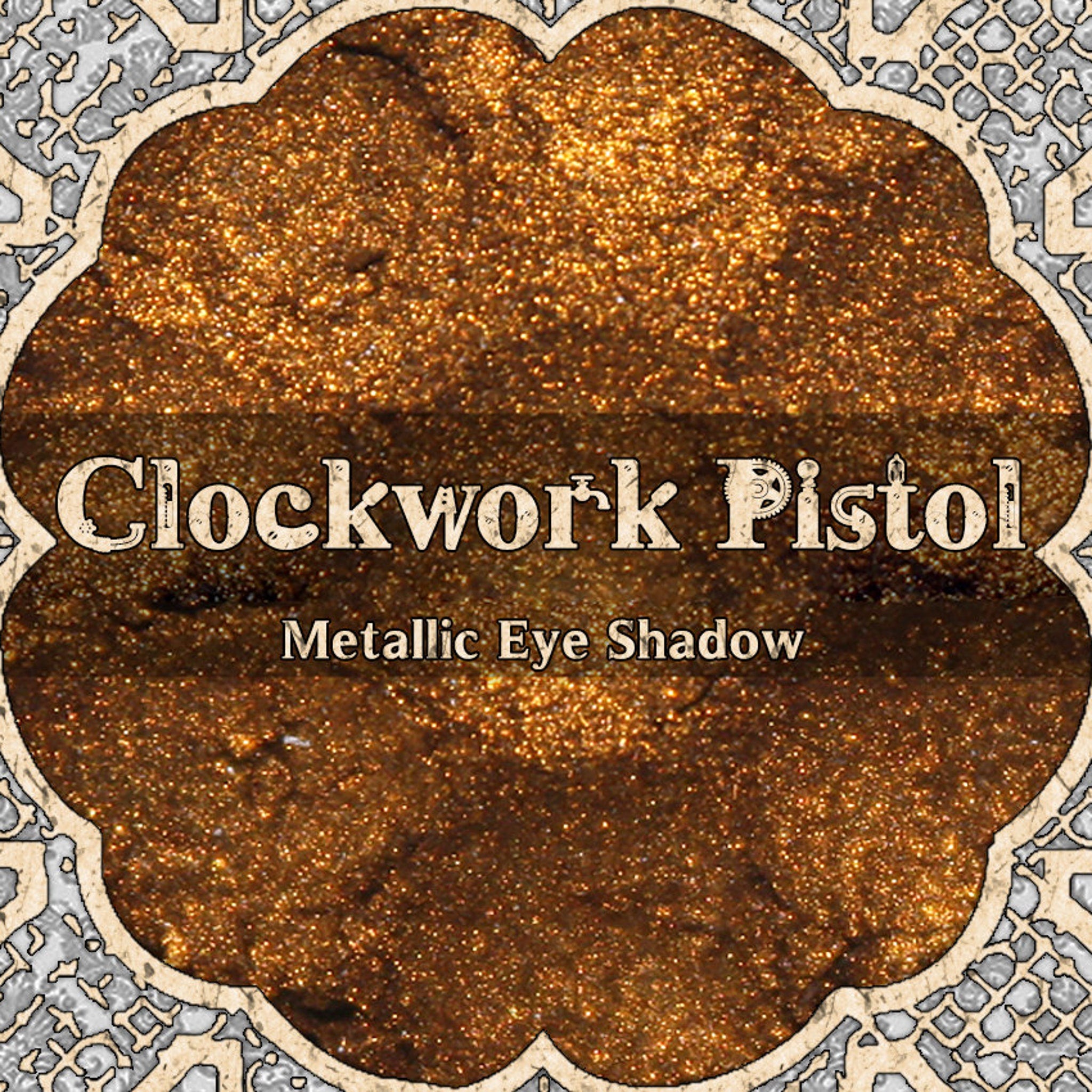 Metallic orange gold vegan loose powder eyeshadow in steampunk-inspired packaging with reflective finish