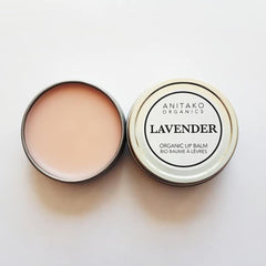 Lip balm in round metal tins, light pink balm, ANITAKO ORGANICS label visible