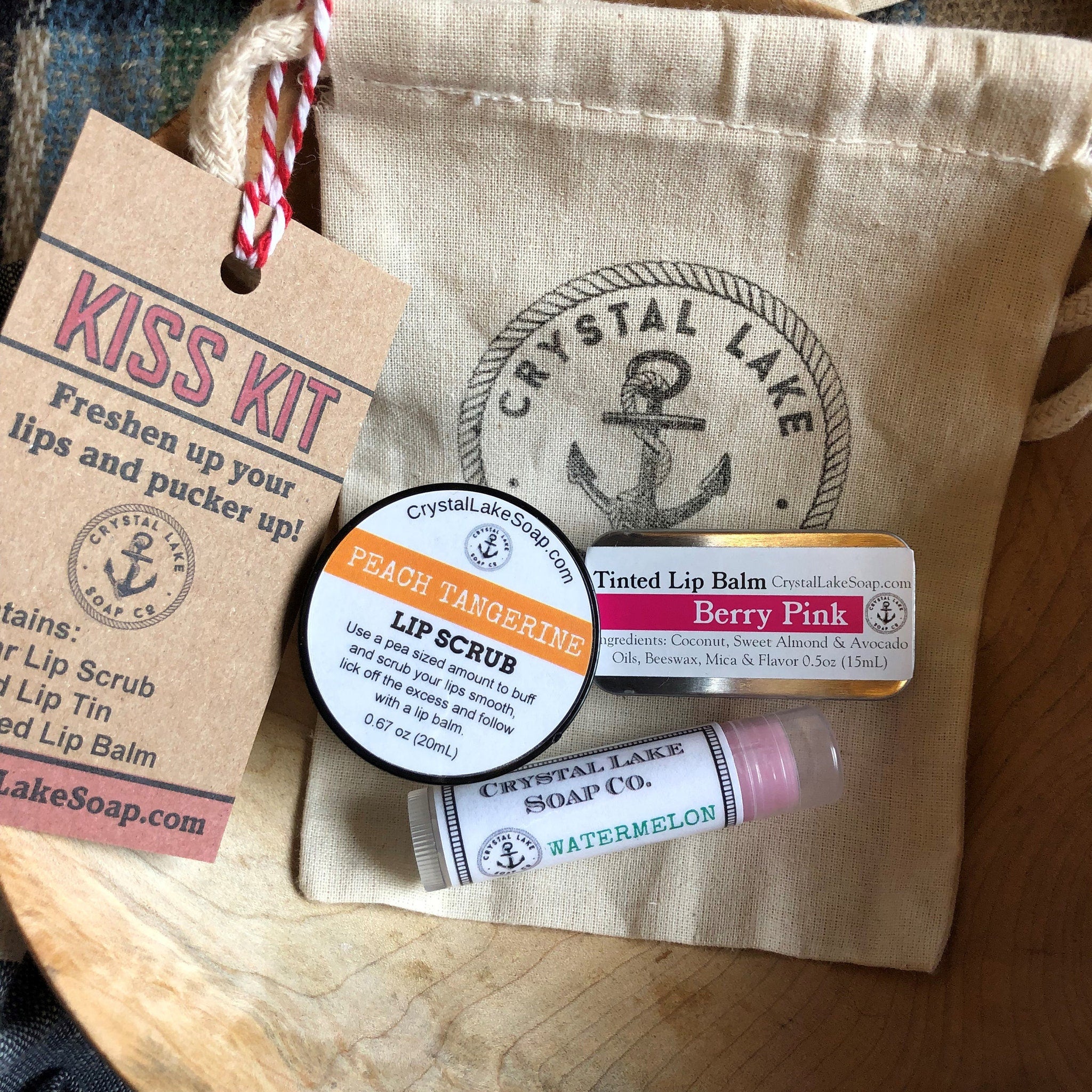 Lip care kit with brown tag, beige bag, and Crystal Lake Soap Co. branding