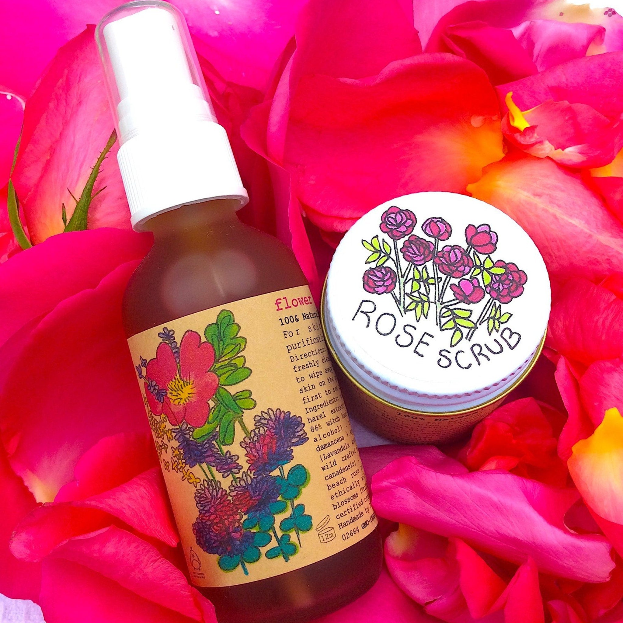 Rose scrub and floral spray bottles on pink rose petals, with "ROSE SCRUB" text visible
