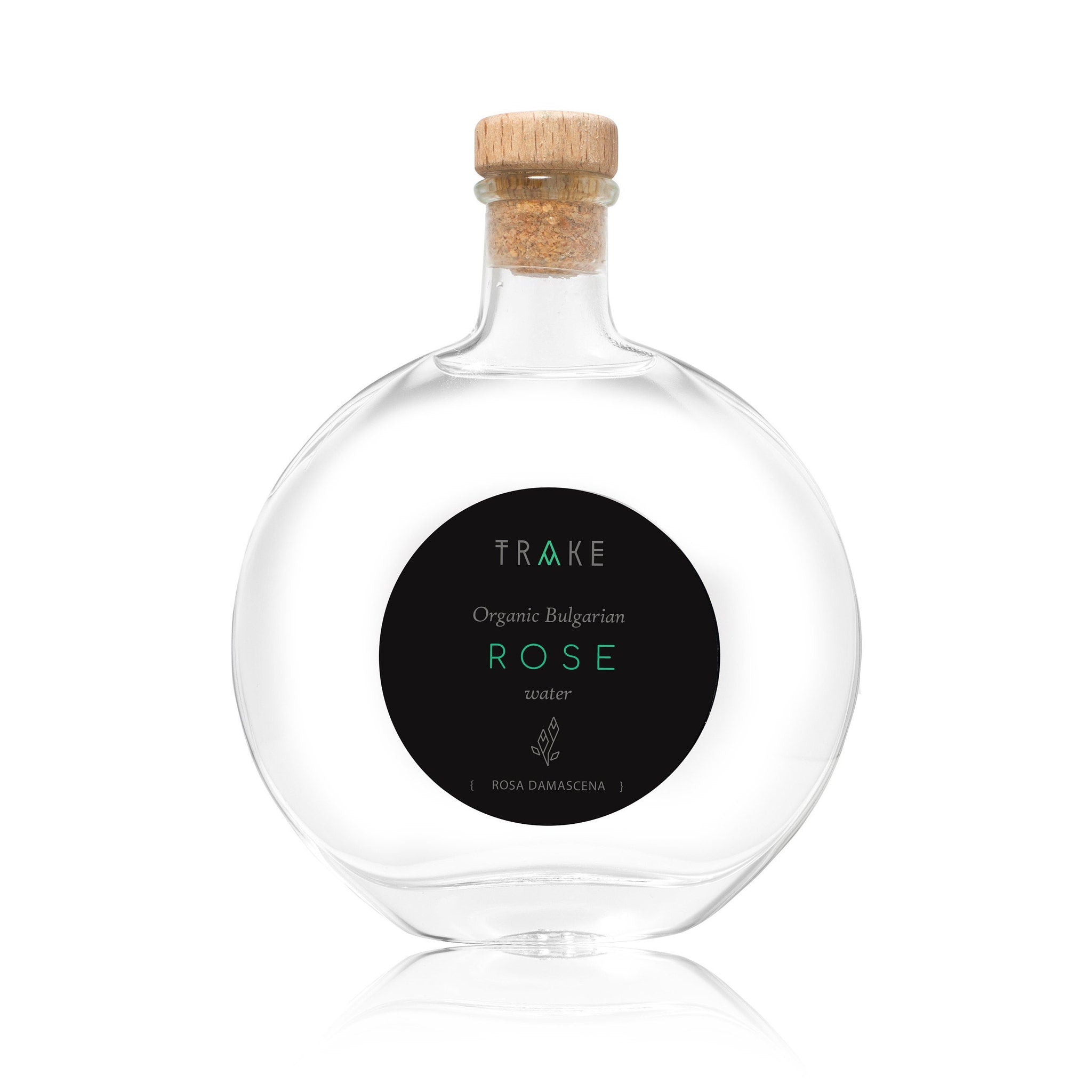 Rose water bottle with clear glass, cork stopper, and black label with text