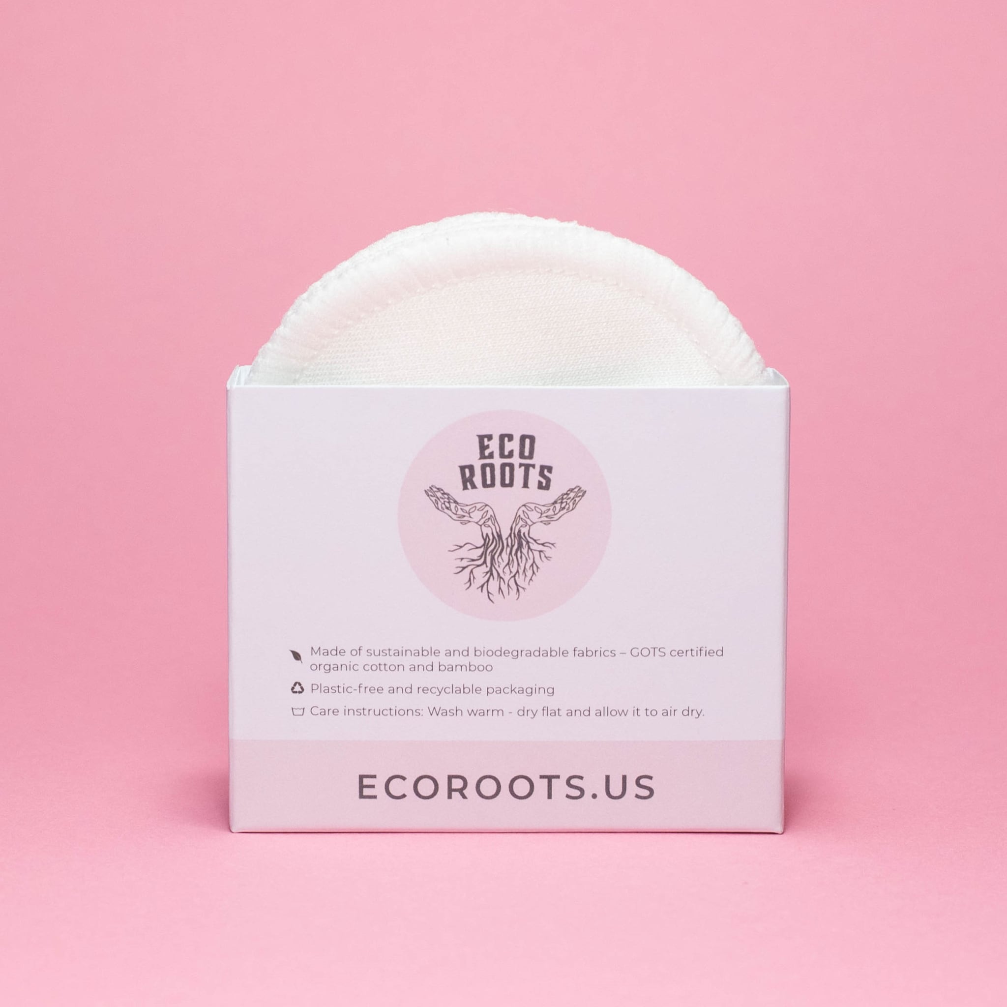 Reusable cotton pads in white, circular shape, and ECO ROOTS box packaging