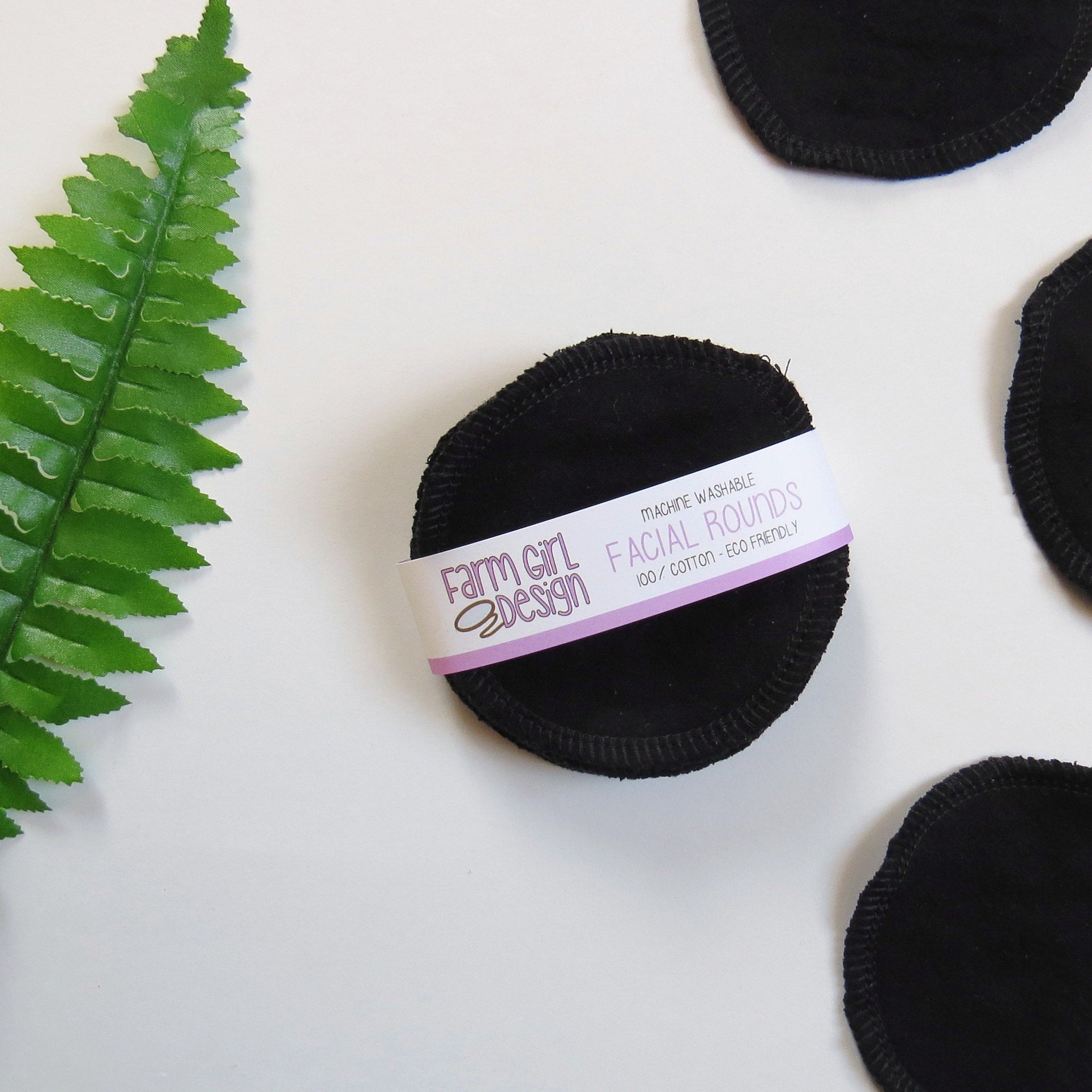 Facial rounds, black cotton pads with stitched edges, Farm Girl Design branding visible