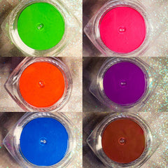 Side view of vibrant neon purple UV eyeshadow pot with glow-in-the-dark pigment for festival makeup looks
