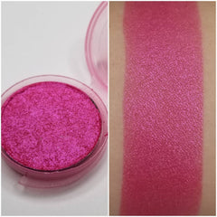 Pressed vegan eyeshadow in vibrant bubblegum pink with smooth matte finish, shown in compact pan.