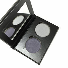 Eyeshadow palette with two silver and one purple eye shadow, black case, mirror inside