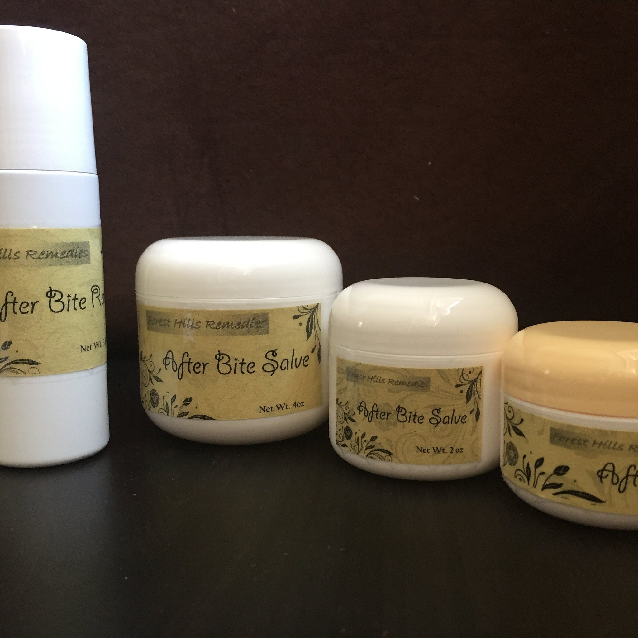 After Bite Salve in white jars with tan labels and black text, Forest Hills Remedies