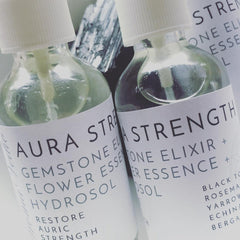 Toner bottles, clear glass with white labels, Crystal Vaults Aura Strength product