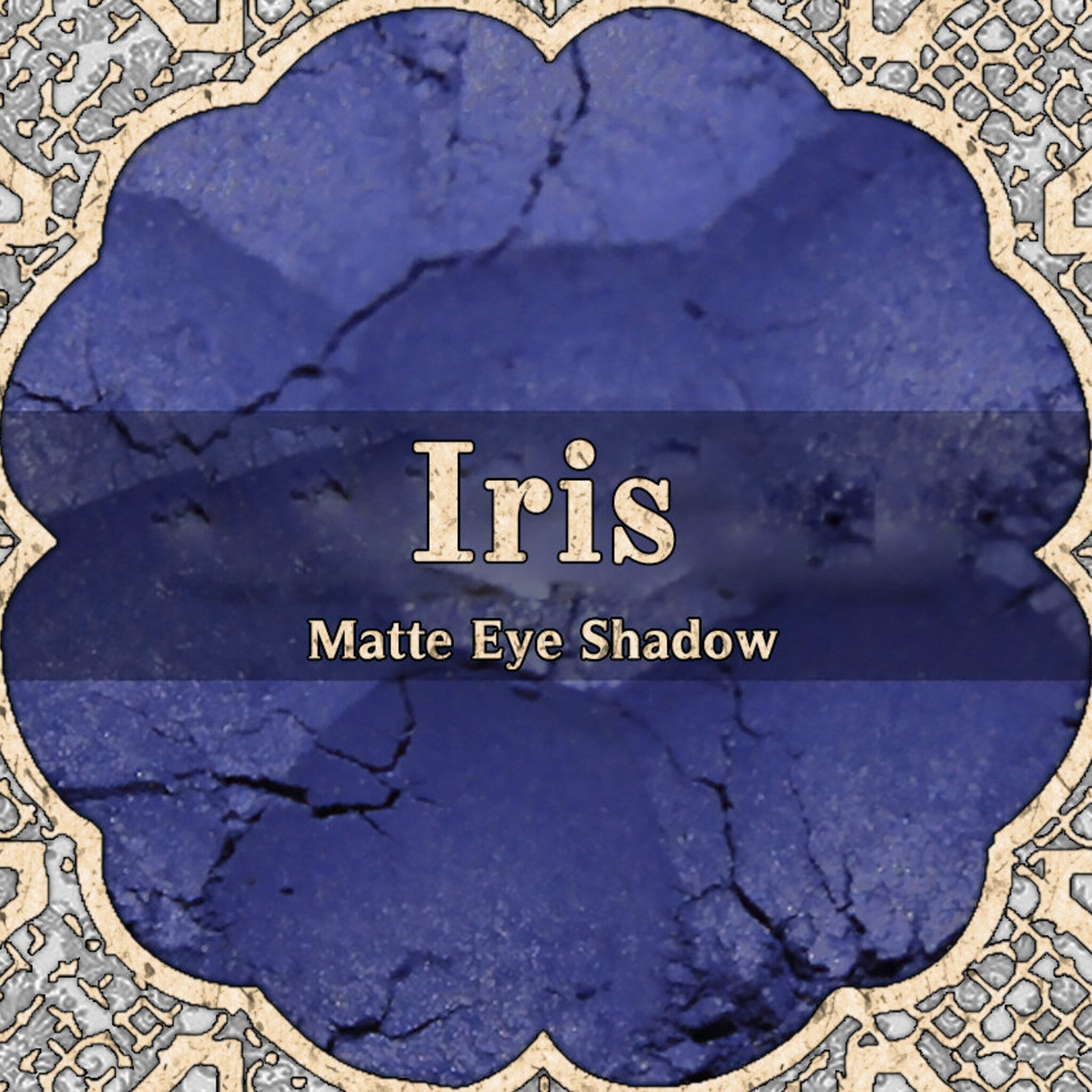 Midtoned violet vegan loose powder eyeshadow in matte finish with blue undertones, displayed in open jar.