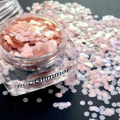 ecoGlimmer glitter, pink hexagonal shapes, in clear jar with brand name visible