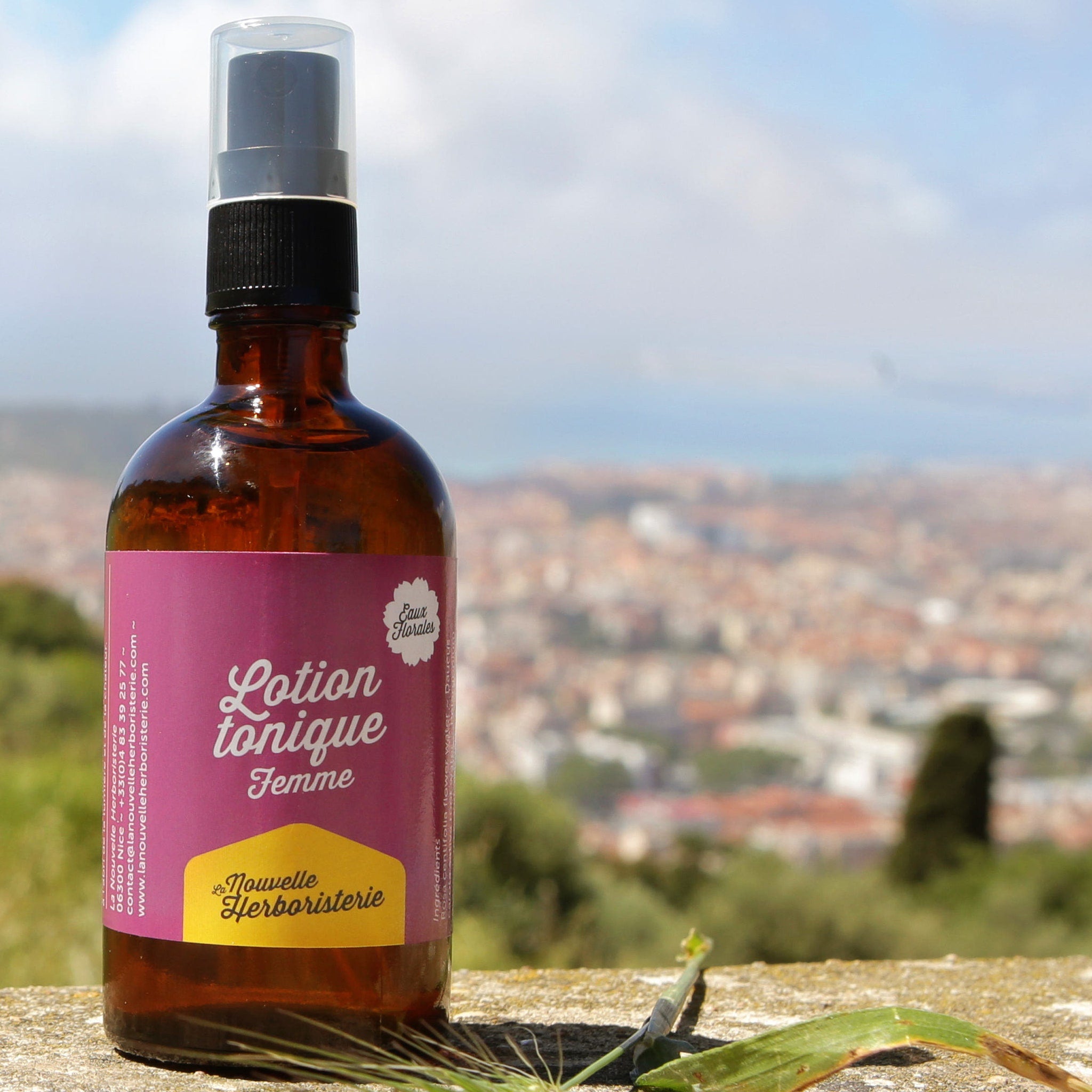 Toner for Women brown glass bottle with black pump and pink label, "Lotion tonique Femme" text visible