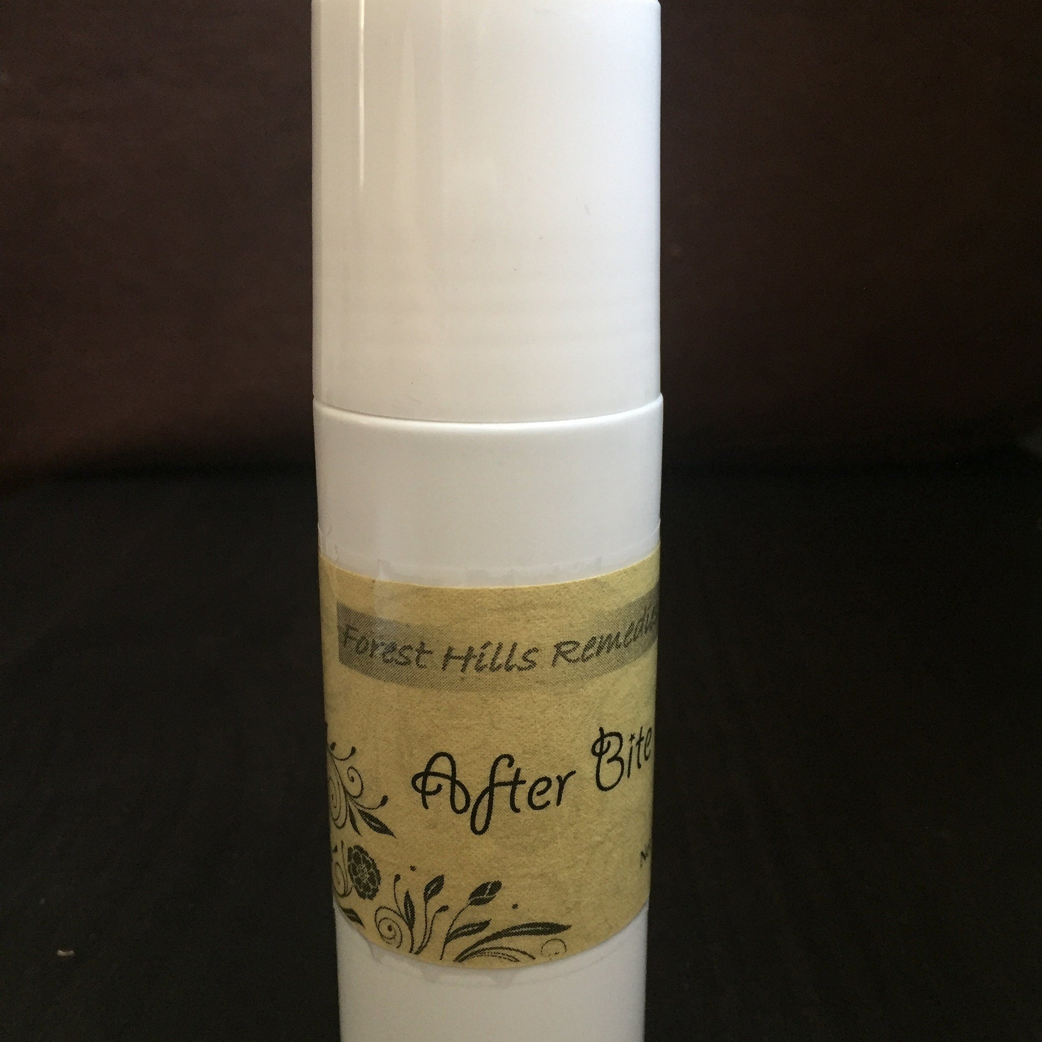 After Bite stick, white plastic tube, tan label with black text and floral design