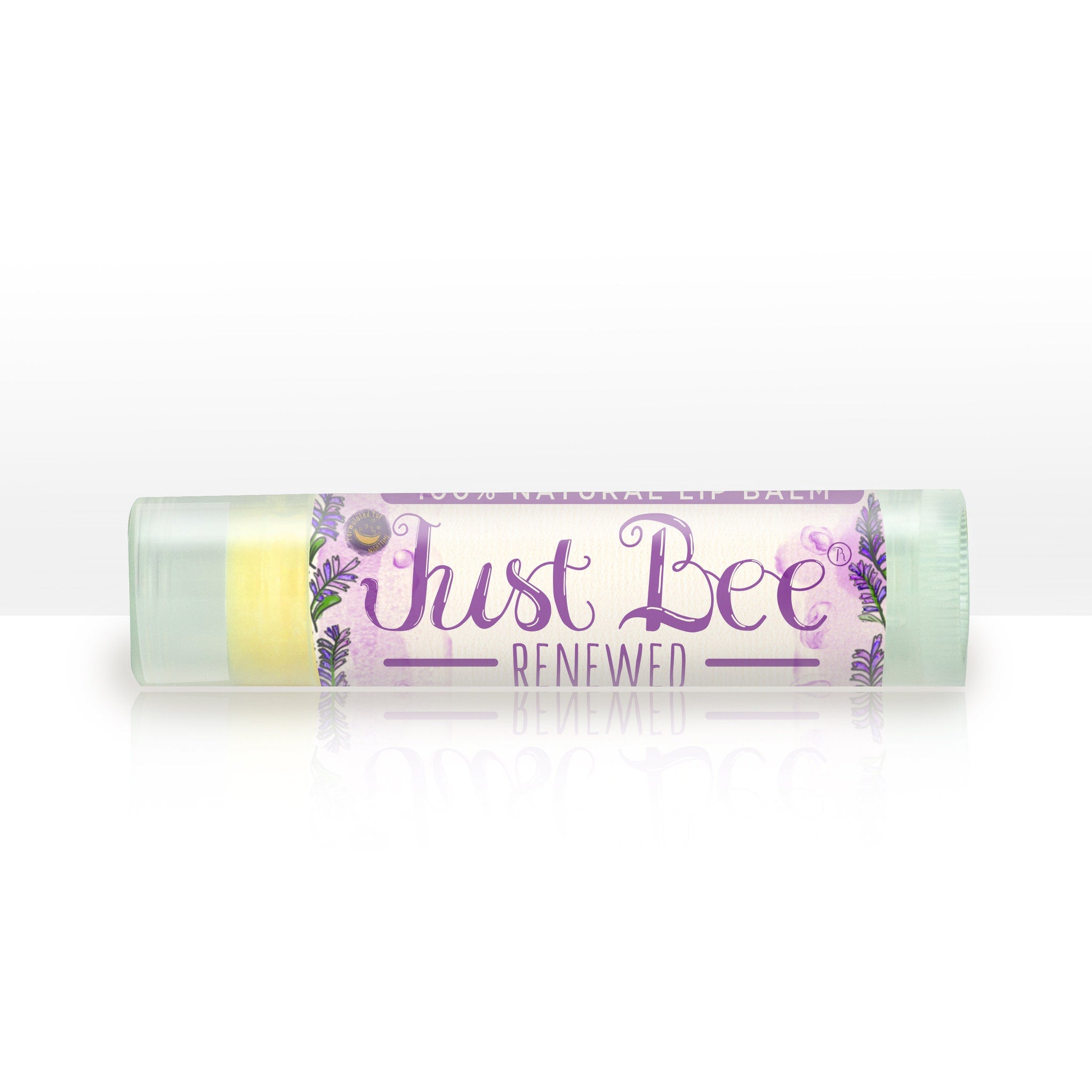 Lip balm tube with lavender design, "Just Bee Renewed" text, and light green cap