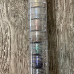 Mineral eyeshadow stack with clear plastic container and various colors visible