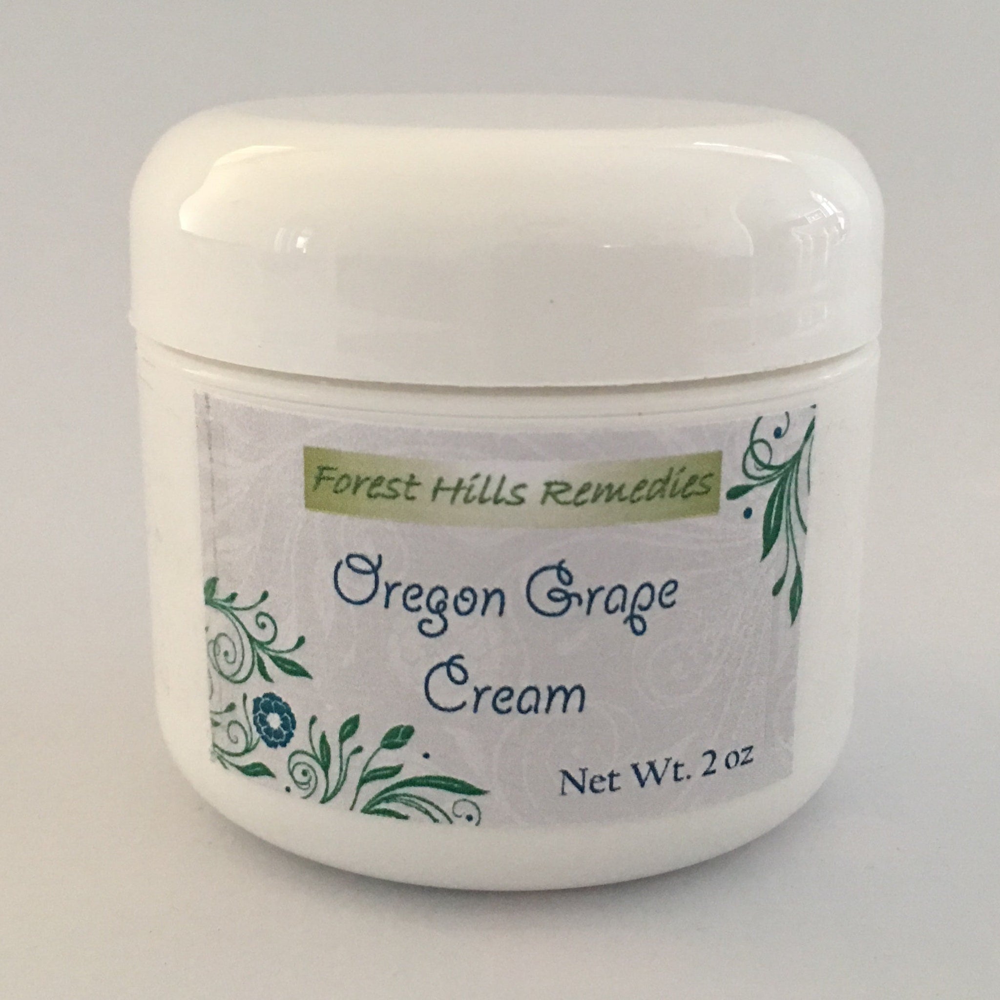 White tube of Oregon grape cream with mahonia aquifolium extract and minimalist green labeling
