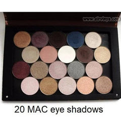 Hand applying shimmering purple marble eyeshadow with a dual-ended brush on eyelid