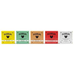 Goldenbeards beard balm in various colors, with brand name and beard illustration on boxes