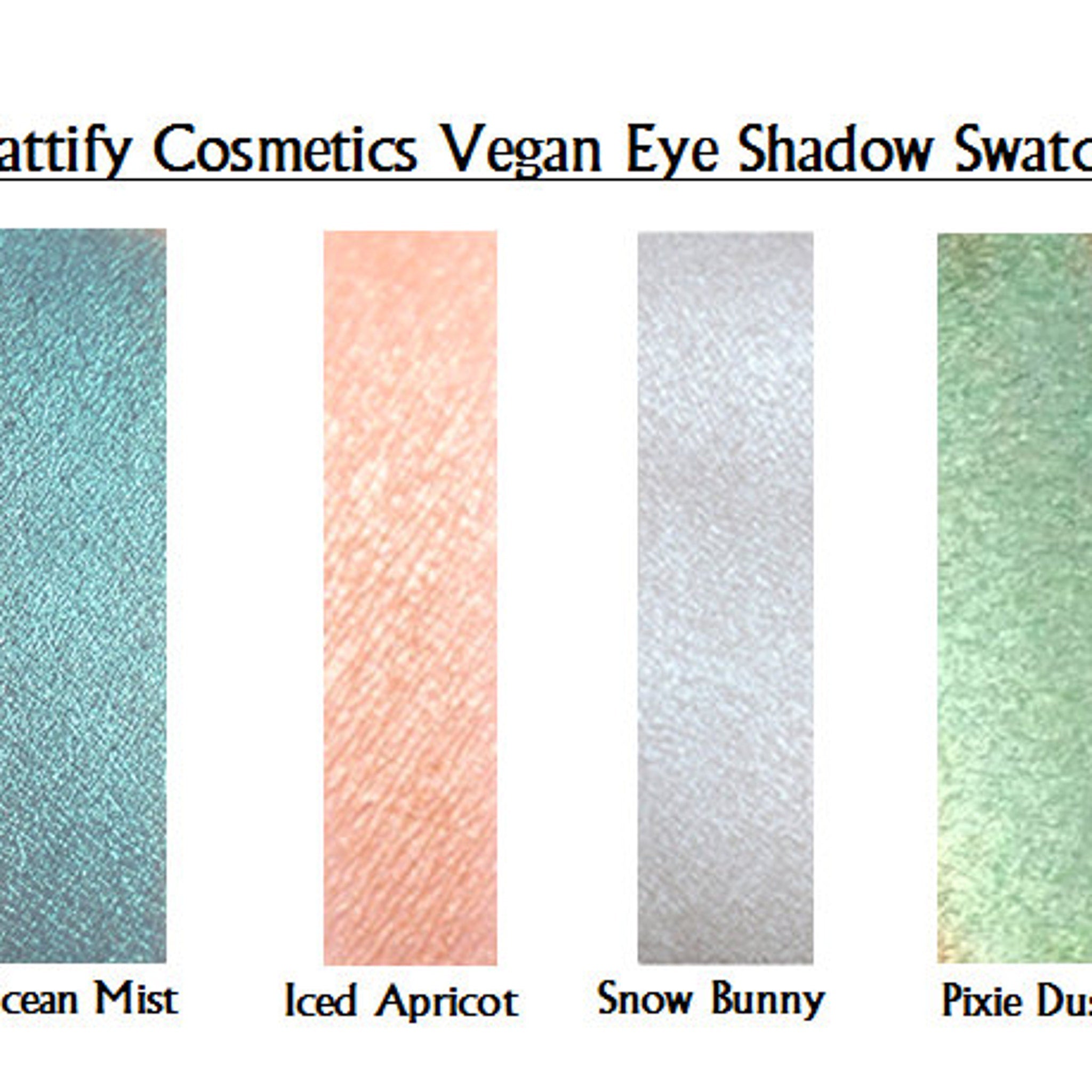Close-up of holographic white eye shadow with sparkling fairy shimmer in compact palette