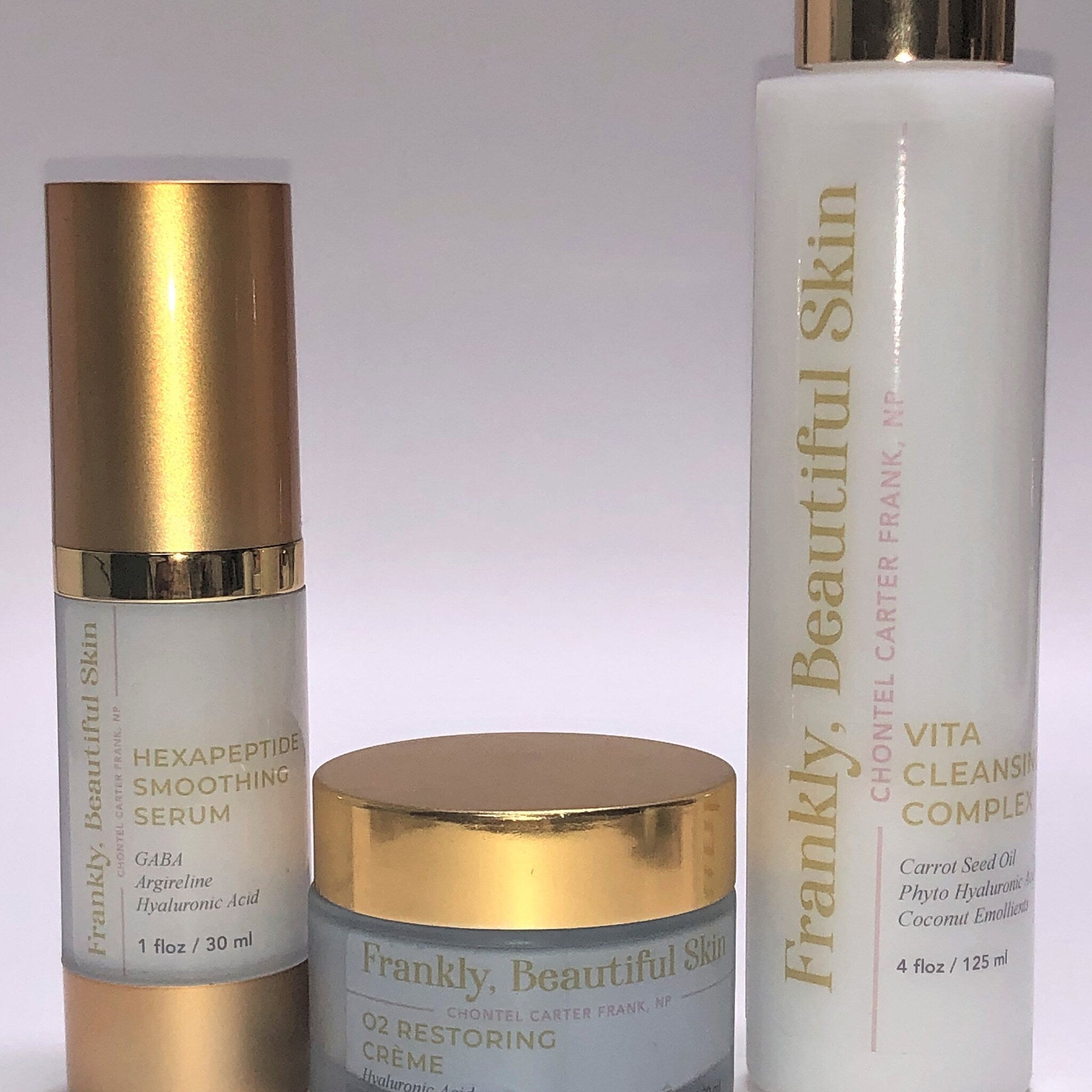 Skincare products, gold and white bottles, blue and gold jar, Frankly, Beautiful Skin branding
