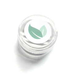 Close-up of bronze metallic eyeshadow pan showing shimmering mineral pigments and smooth pressed texture