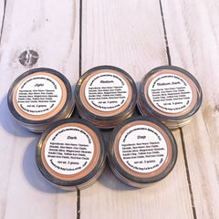 Mineral powder makeup in various shades, labeled "Light" to "Deep", from Beauty by Kayla Lou