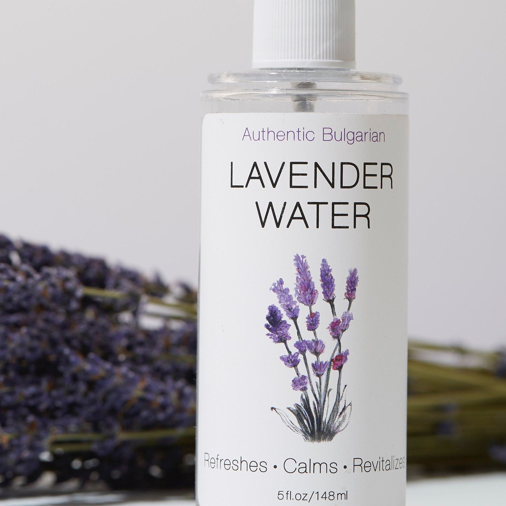Toner bottle with lavender illustration, clear glass, white label, and purple text