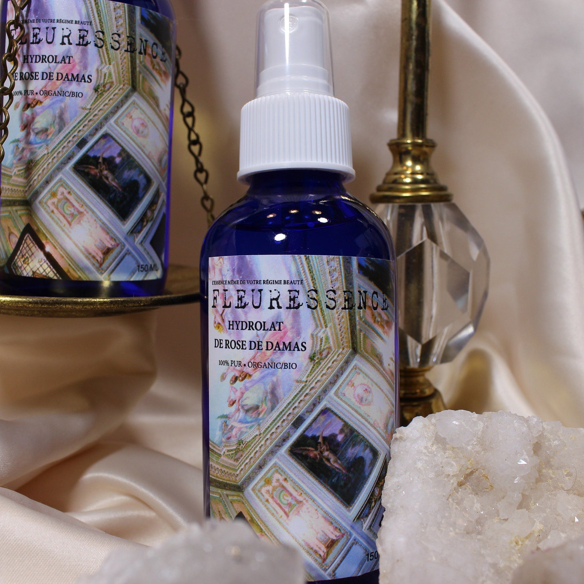 Hydrolat spray bottle, blue glass, white sprayer, FleurEssence label on display