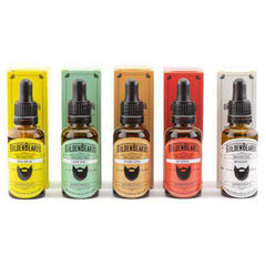 Beard oil bottles with black droppers, various colored labels, and Golden Beards branding