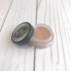 Mineral contour powder with tan color, clear plastic jar, and Beauty by Kayla Lou label