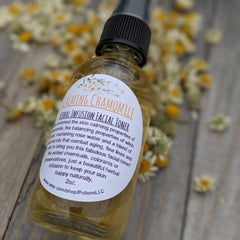 Facial toner bottle with yellow liquid, black cap, and white label with text on wooden surface